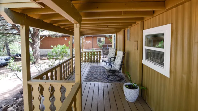 a view of a deck with wooden floor and furniture