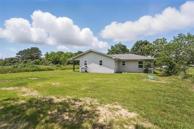 a big house with swimming pool in front of it