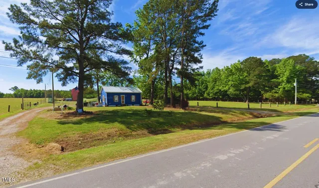 a view of a park with large trees