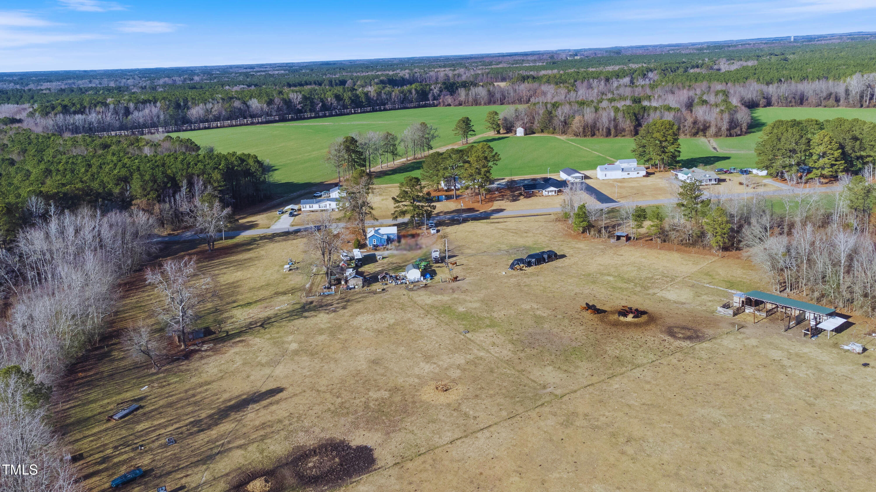 9153 St Mary's Church Road Kenly, NC 27542 - Photo 3 of 8 an aerial view of a house with a garden and lake view