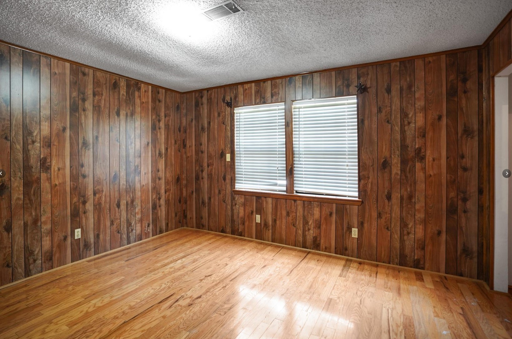 22855 East Martin Drive Porter, TX 77365 - Photo 19 of 22 a view of an empty room with wooden floor and a window
