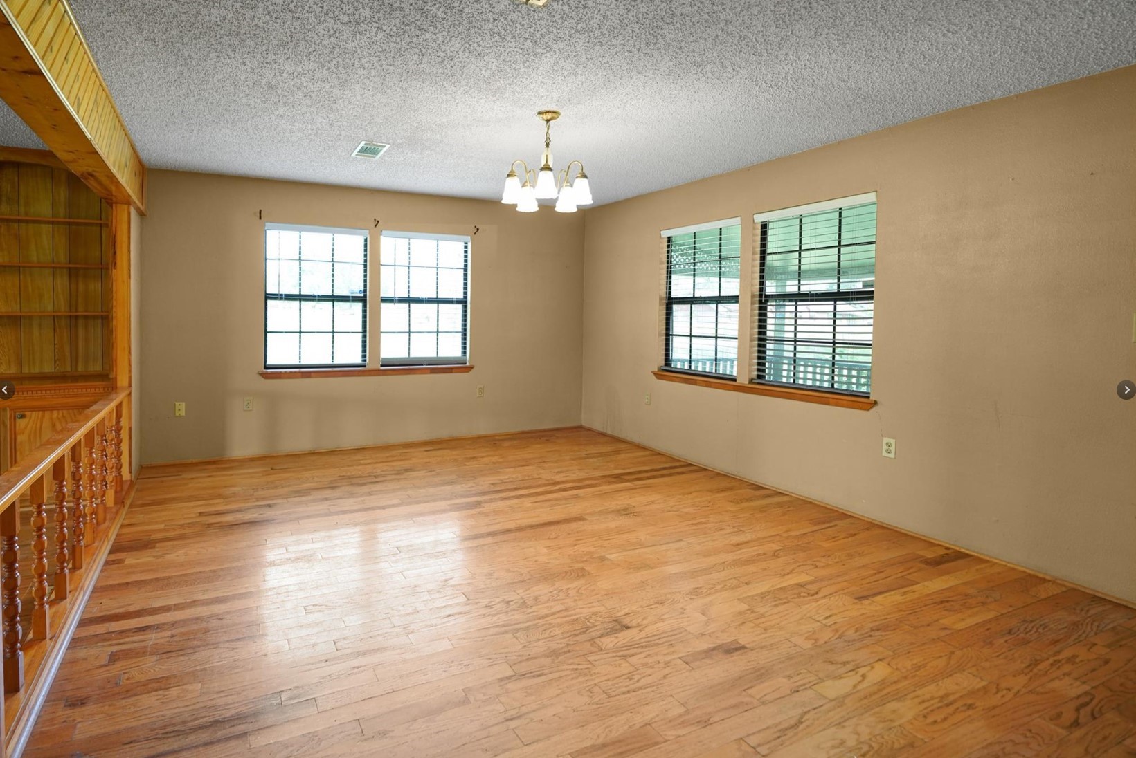 22855 East Martin Drive Porter, TX 77365 - Photo 21 of 22 a view of an empty room with wooden floor and a window