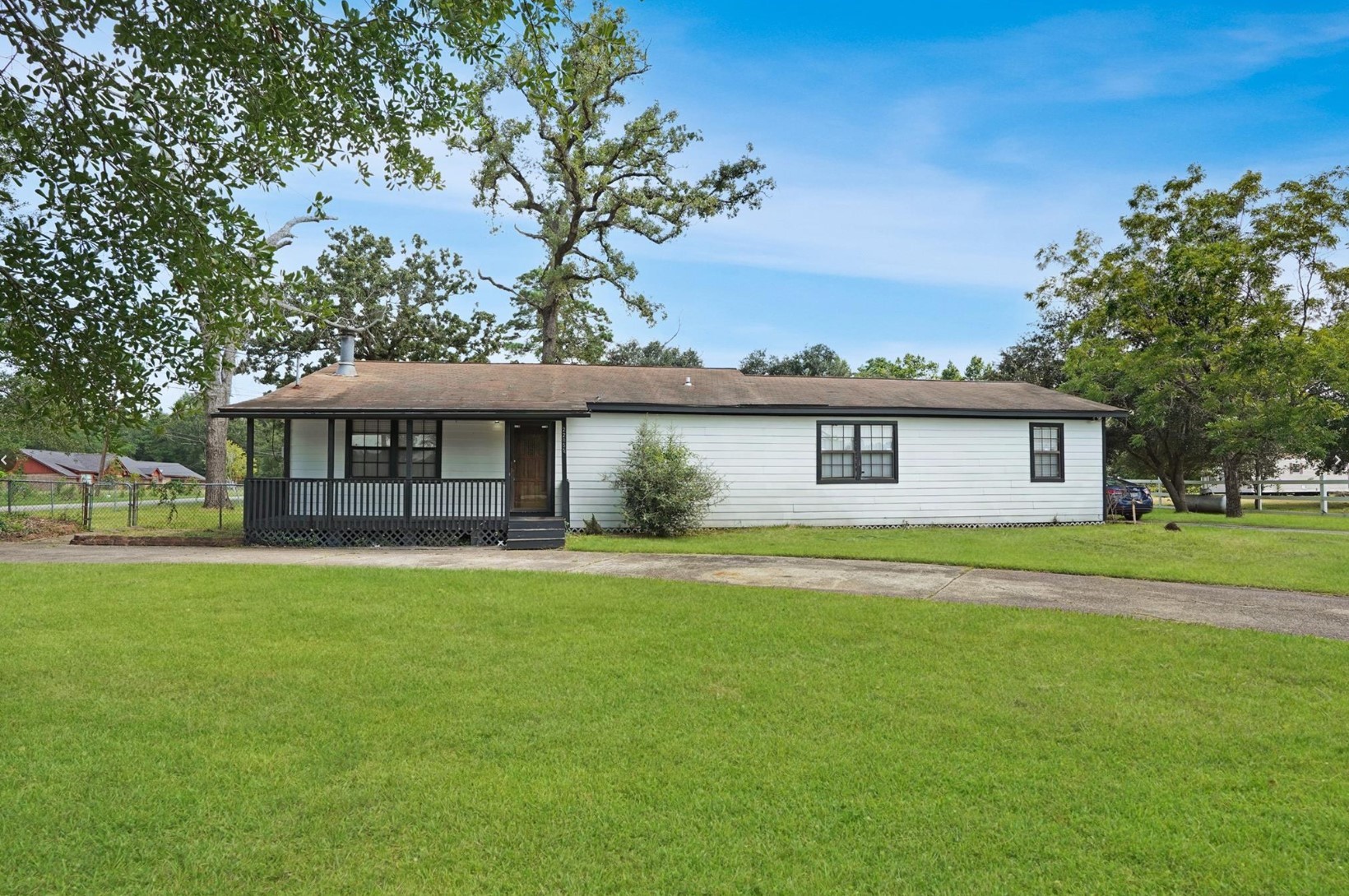 22855 East Martin Drive Porter, TX 77365 - Photo 3 of 22 a front view of a house with a garden