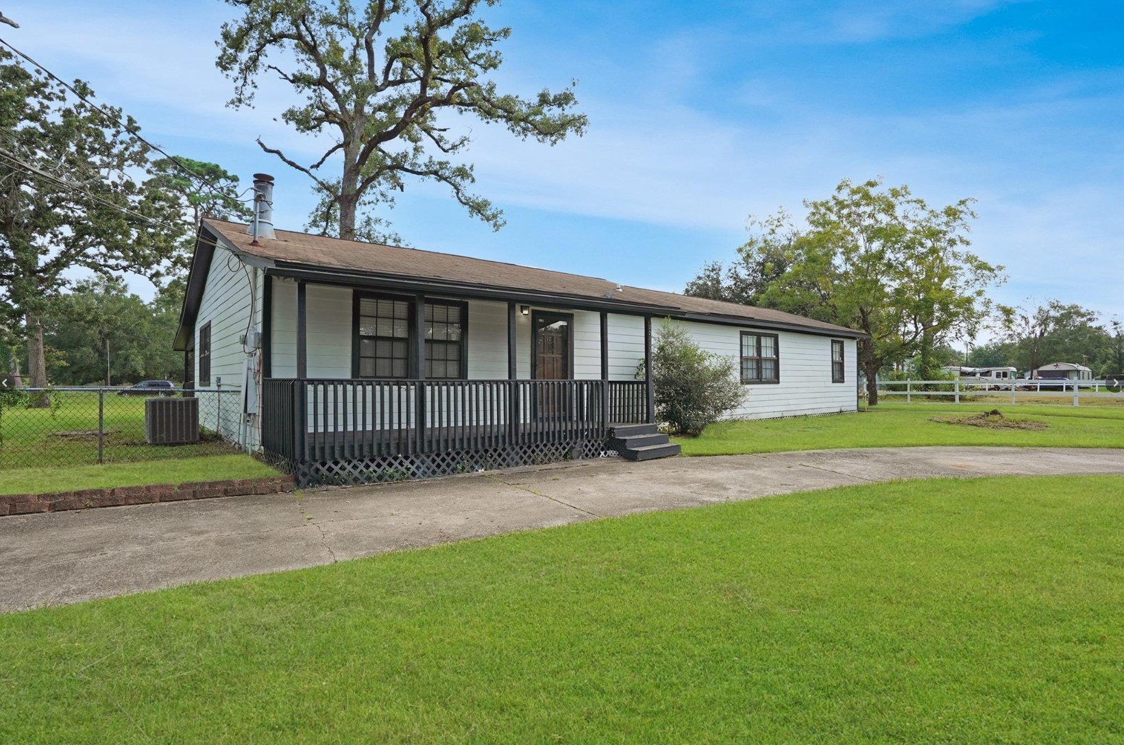 22855 East Martin Drive Porter, TX 77365 - Photo 5 of 22 a view of a house with backyard and a tree