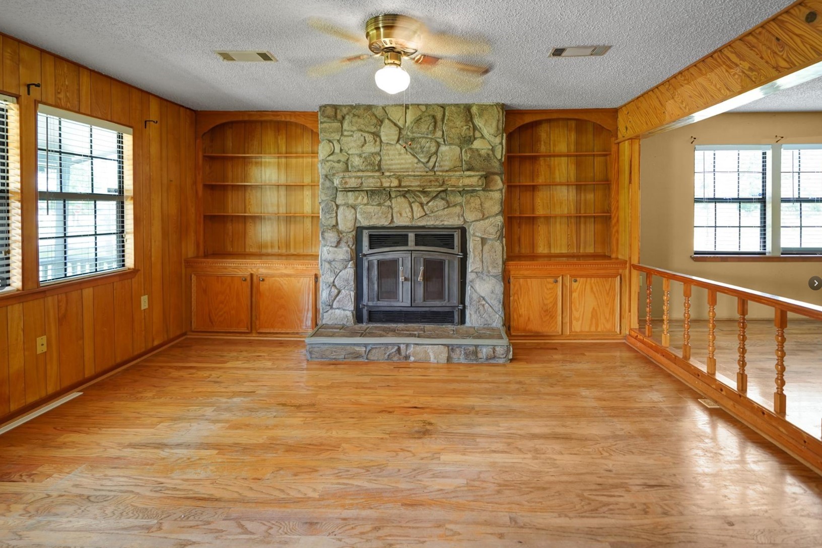 22855 East Martin Drive Porter, TX 77365 - Photo 10 of 22 a view of an empty room with a fireplace and a window