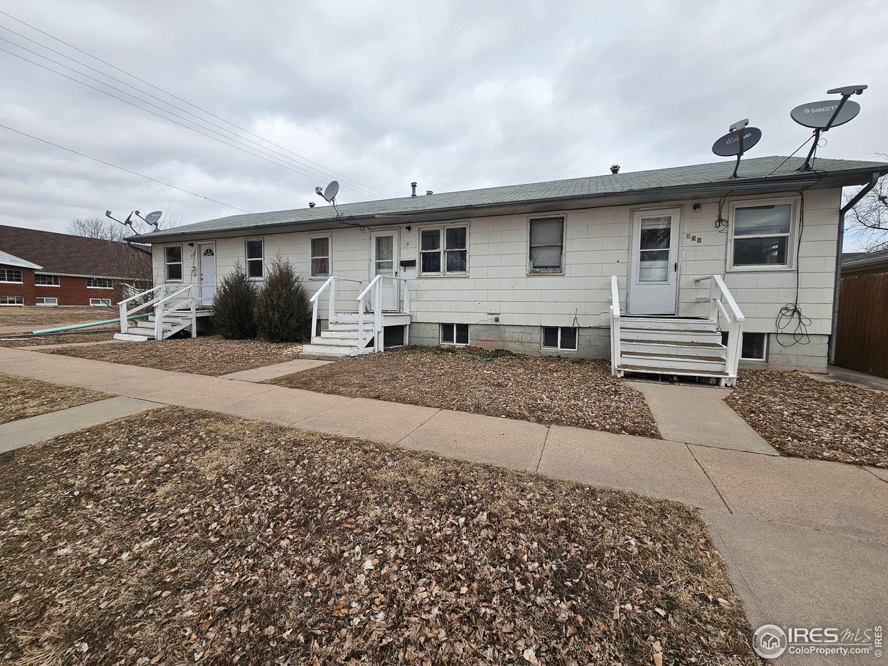 351 East 2nd Street Akron, CO 80720 - Photo 1 of 23 a front view of a house with a yard