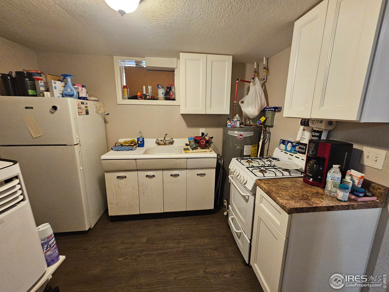 351 East 2nd Street Akron, CO 80720 - Photo 9 of 23 a kitchen with a sink stove and refrigerator