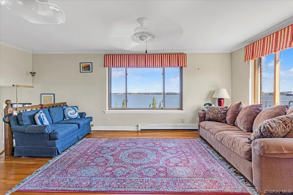 a living room with a couch and a large window