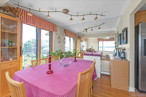a dining room with large window