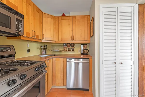 a kitchen with a stove and a microwave
