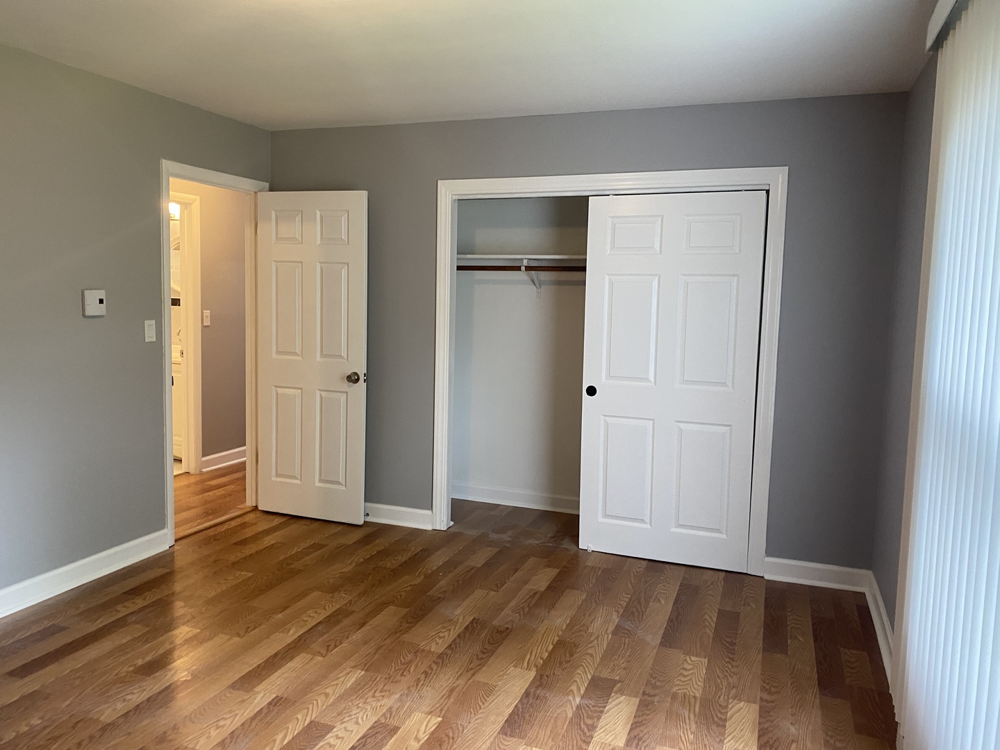 1710 Felten Road, Unit 1B Aurora, IL 60505 - Photo 4 of 14 a view of an empty room with wooden floor and closet