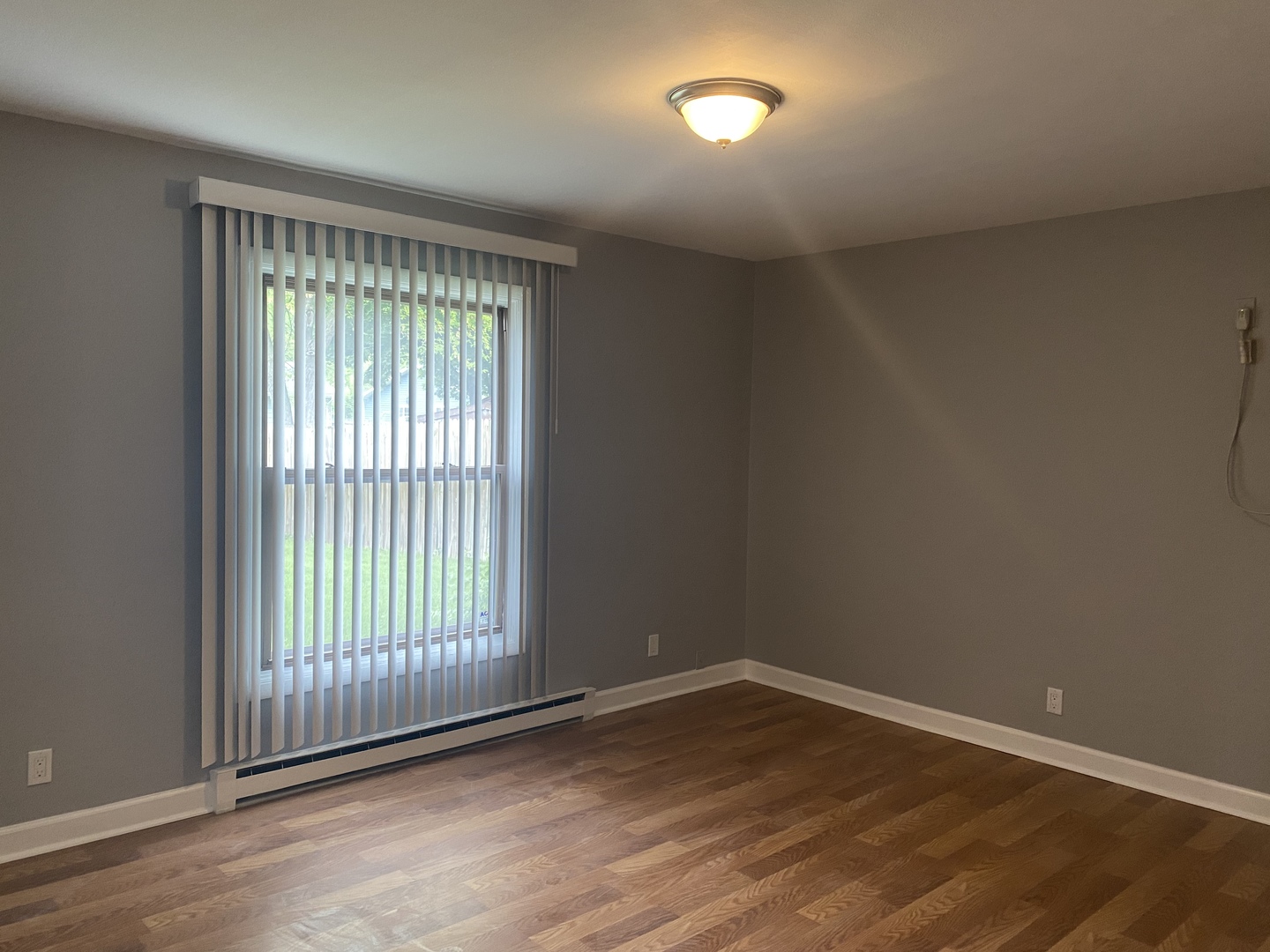 1710 Felten Road, Unit 1B Aurora, IL 60505 - Photo 5 of 14 wooden floor in an empty room with a window