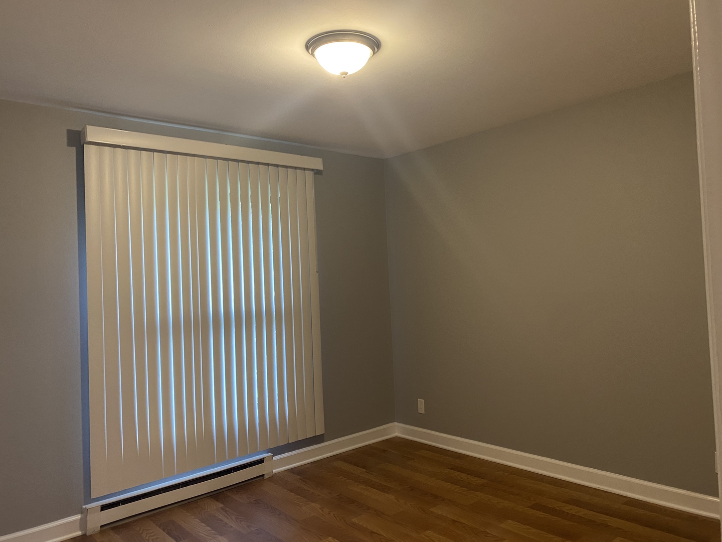 1710 Felten Road, Unit 1B Aurora, IL 60505 - Photo 6 of 14 an empty room with wooden floor
