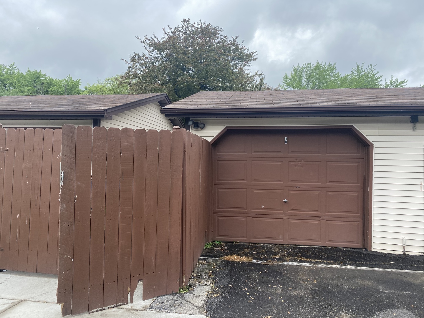 1710 Felten Road, Unit 1B Aurora, IL 60505 - Photo 8 of 14 a side view of a house with a garage