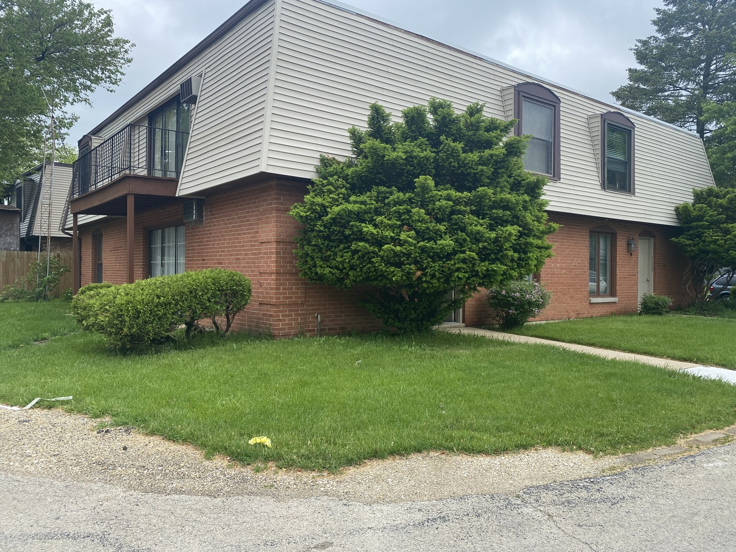 1710 Felten Road, Unit 1B Aurora, IL 60505 - Photo 9 of 14 a view of a house with a yard plants and a large tree