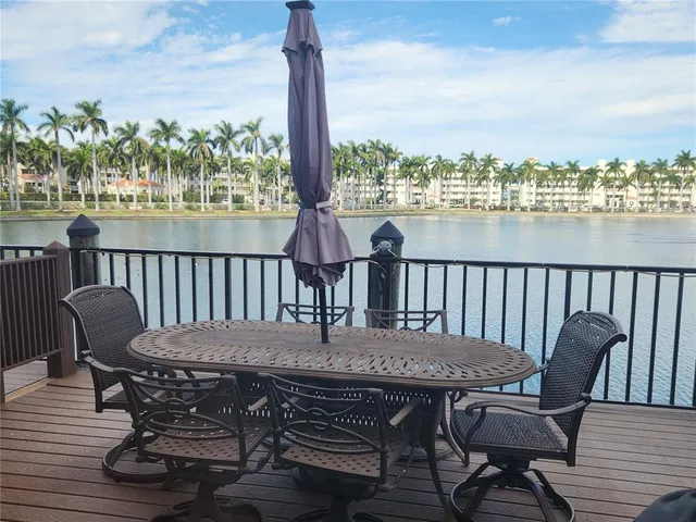 a view of a balcony with table and chairs
