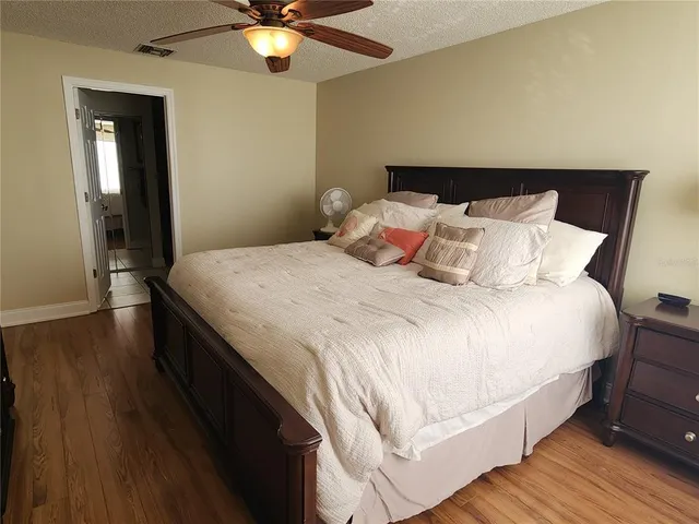 a bed room with a bed and a chandelier