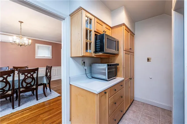 a kitchen with stainless steel appliances a refrigerator sink and cabinets