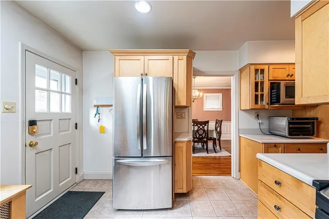 a kitchen with a refrigerator and a sink