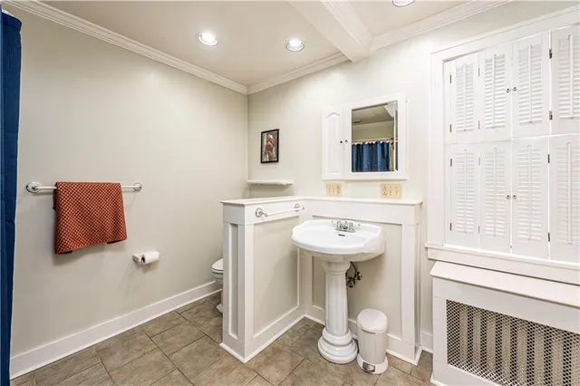 a view of a hallway with wooden floor and stairs