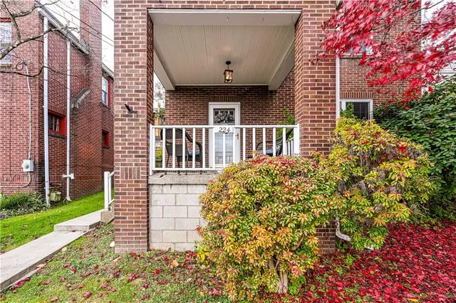front view of a house with a garden