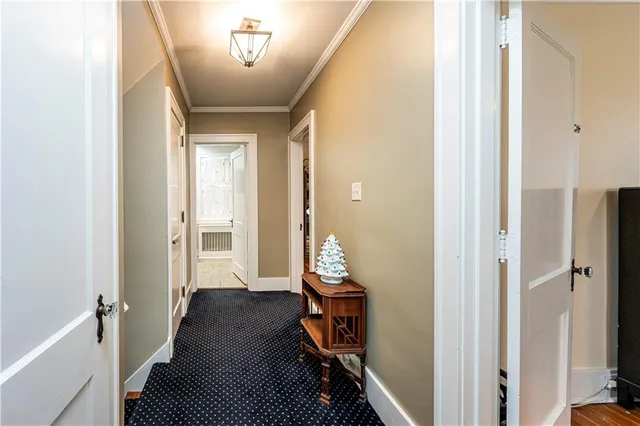 a view of room with furniture and wooden floor