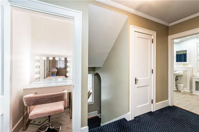 a view of gallery with wooden floor