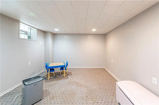 a backyard of a house with a yard and garage