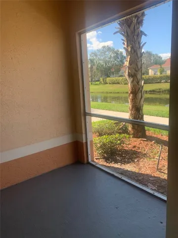 a view of a room with a large window