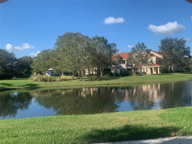 a view of a lake with a building in the background