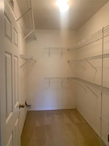 a view of a room with racks on the wall