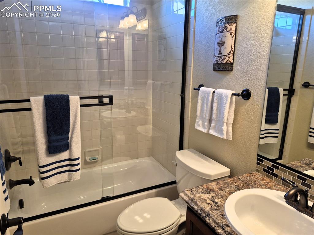 7619 Eagle Feather Point Colorado Springs, CO 80923 - Photo 13 of 23 a bathroom with a sink toilet and shower