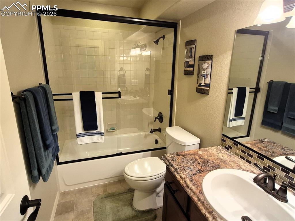 7619 Eagle Feather Point Colorado Springs, CO 80923 - Photo 14 of 23 a bathroom with a sink toilet and shower