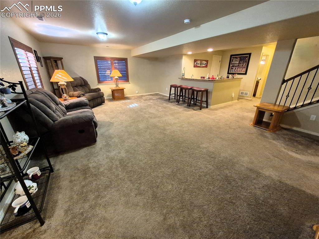 7619 Eagle Feather Point Colorado Springs, CO 80923 - Photo 18 of 23 a living room with furniture