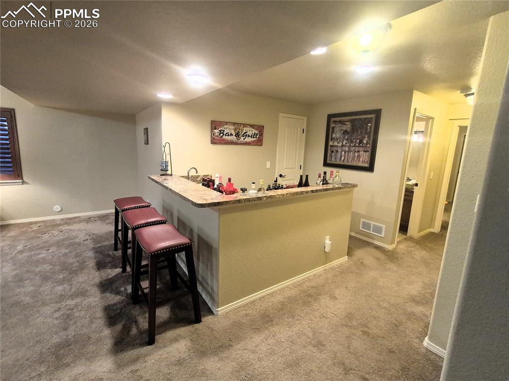 7619 Eagle Feather Point Colorado Springs, CO 80923 - Photo 20 of 23 a workspace with furniture and window