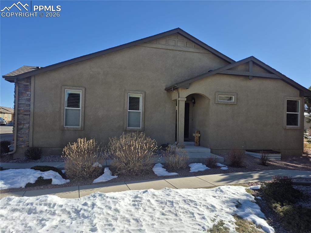 7619 Eagle Feather Point Colorado Springs, CO 80923 - Photo 2 of 23 a front view of a house