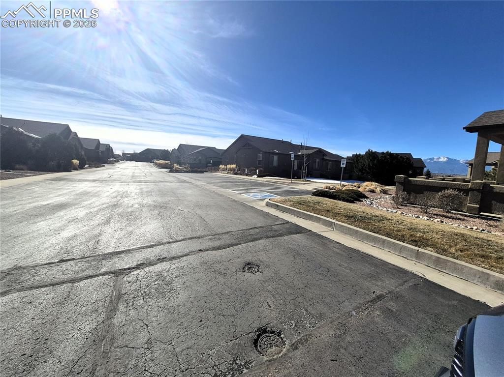 7619 Eagle Feather Point Colorado Springs, CO 80923 - Photo 23 of 23 a view of a road with an ocean view