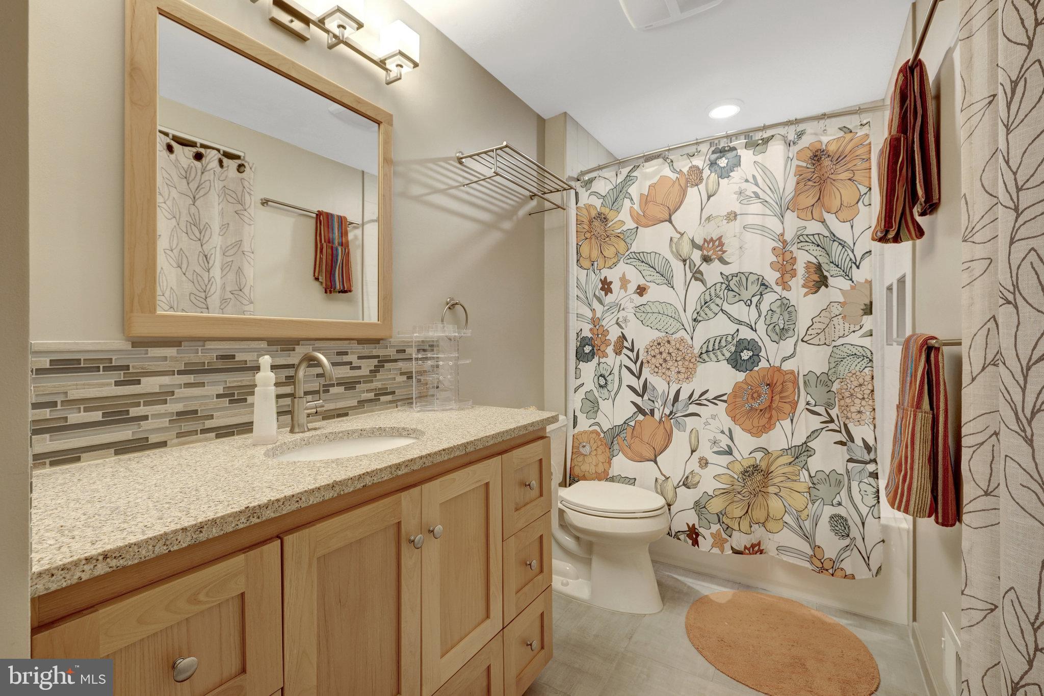 11637 Quail Ridge Court Reston, VA 20194 - Photo 27 of 46 a bathroom with a sink toilet and shower