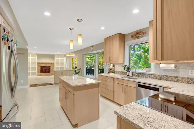 a view of a dining room with furniture and window