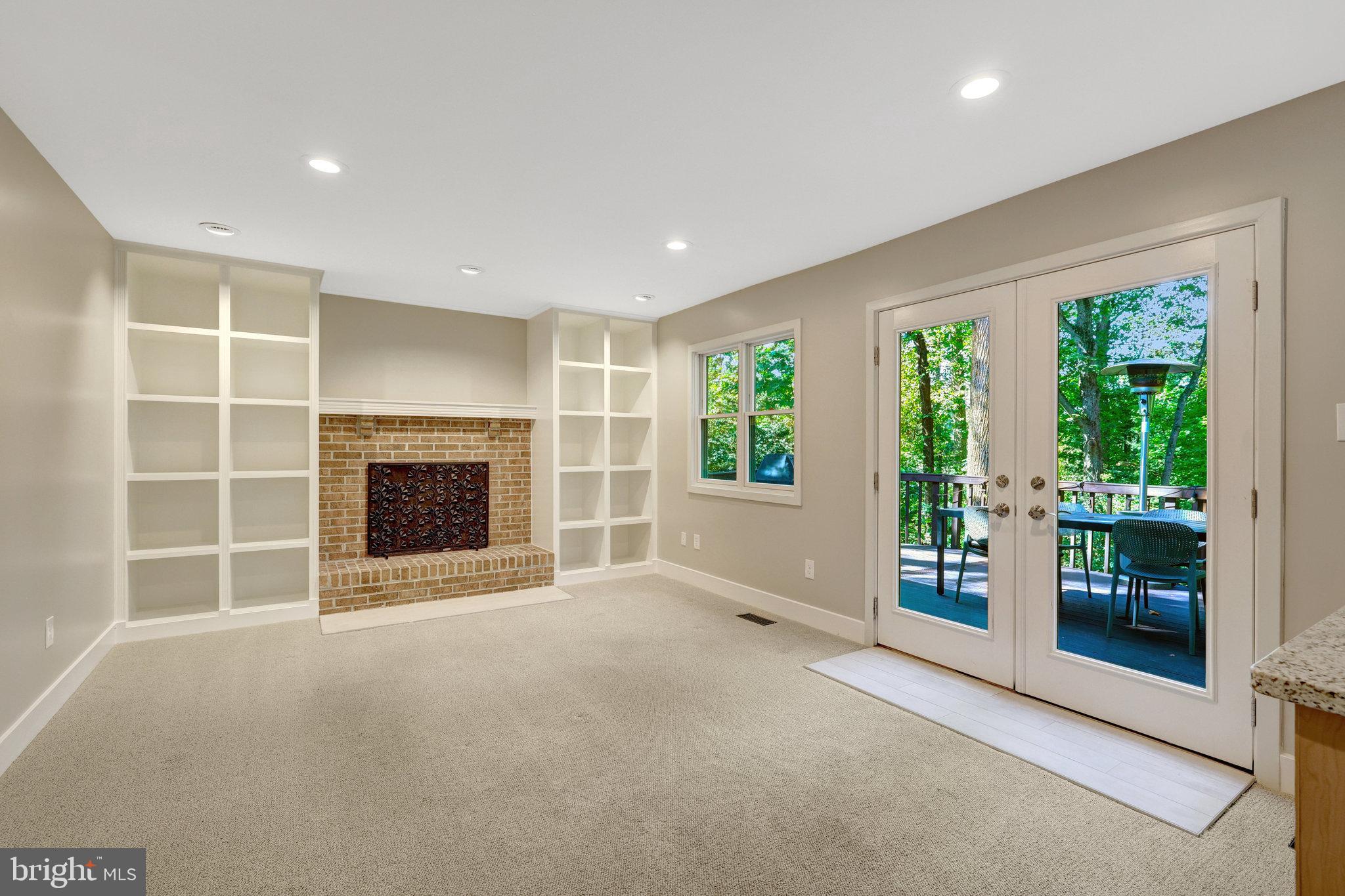 11637 Quail Ridge Court Reston, VA 20194 - Photo 10 of 46 an empty room with furniture and a fireplace