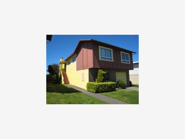 a picture of a bench in front of a house