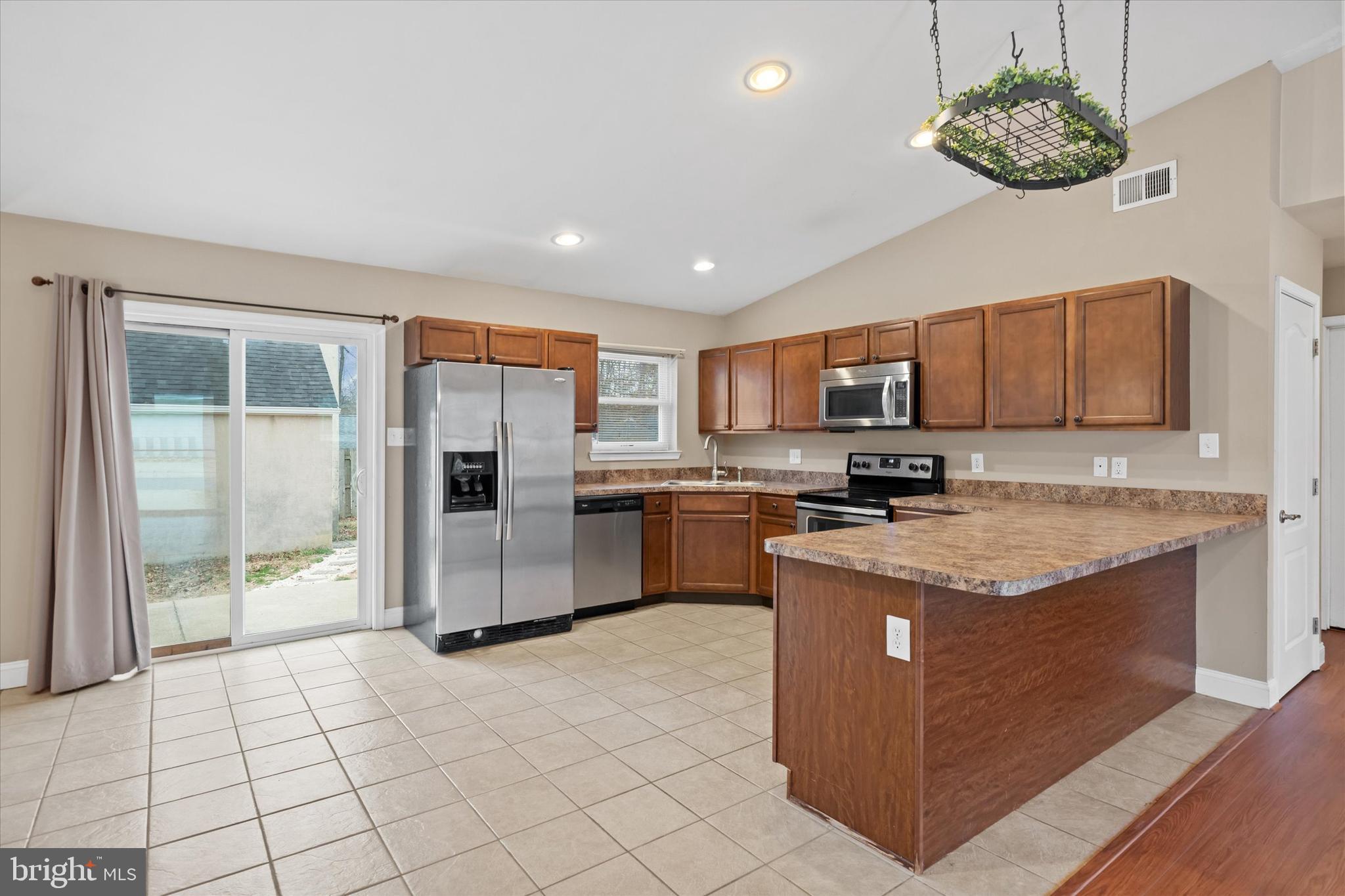 17 Gogh Circle Newark, DE 19702 - Photo 11 of 34 a kitchen with stainless steel appliances granite countertop a stove a sink dishwasher a refrigerator and a oven with wooden floor