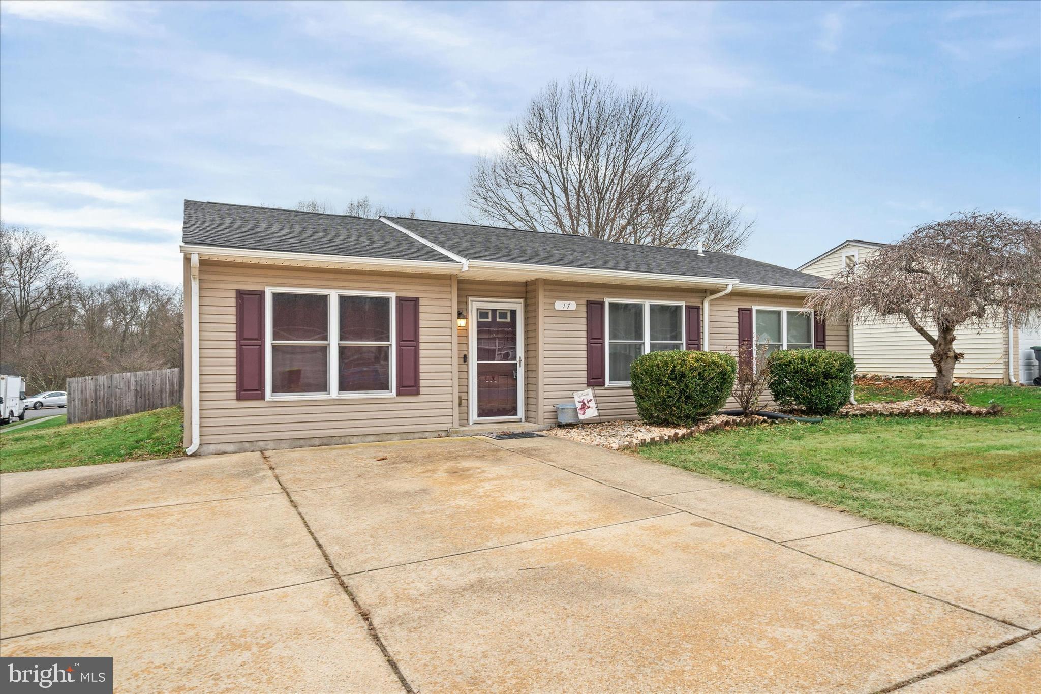 17 Gogh Circle Newark, DE 19702 - Photo 2 of 34 a front view of a house with a yard and garage