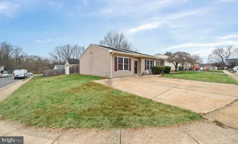 a backyard of a house with large trees