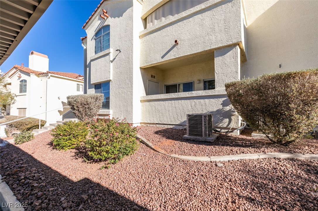 698 South Racetrack Road, Unit 711 Henderson, NV 89015 - Photo 4 of 25 View of side of property featuring stucco siding