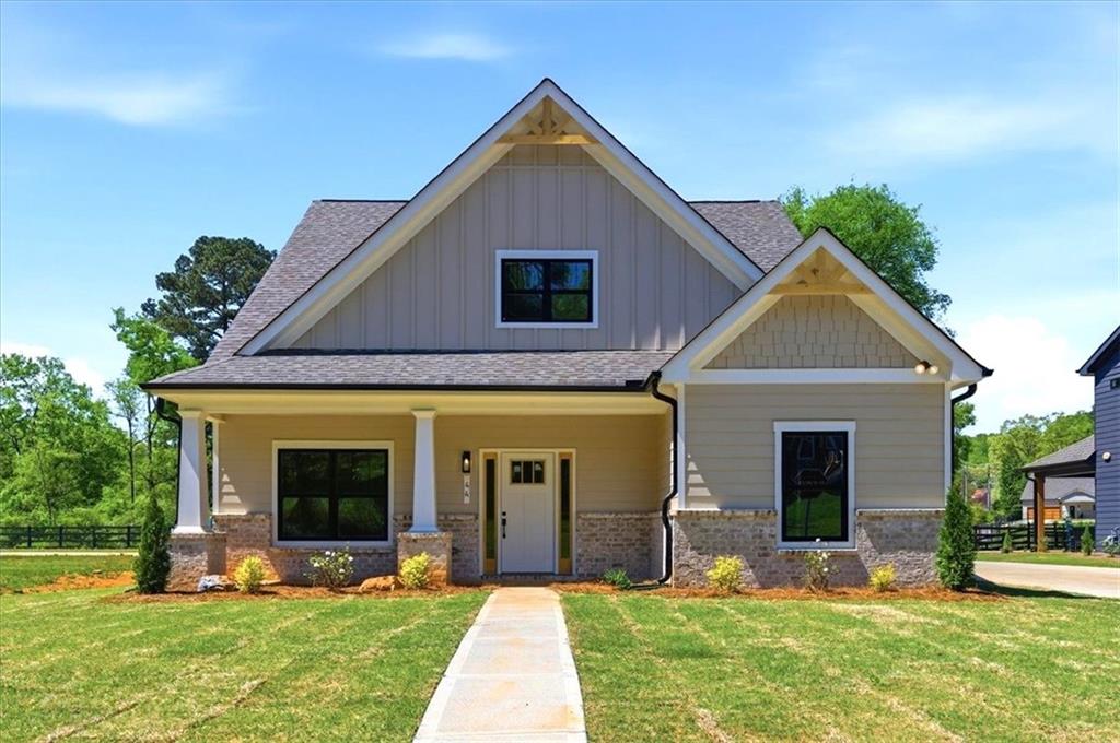 44 Puckett Road Emerson, GA 30137 - Photo 1 of 38 a front view of house with yard and green space
