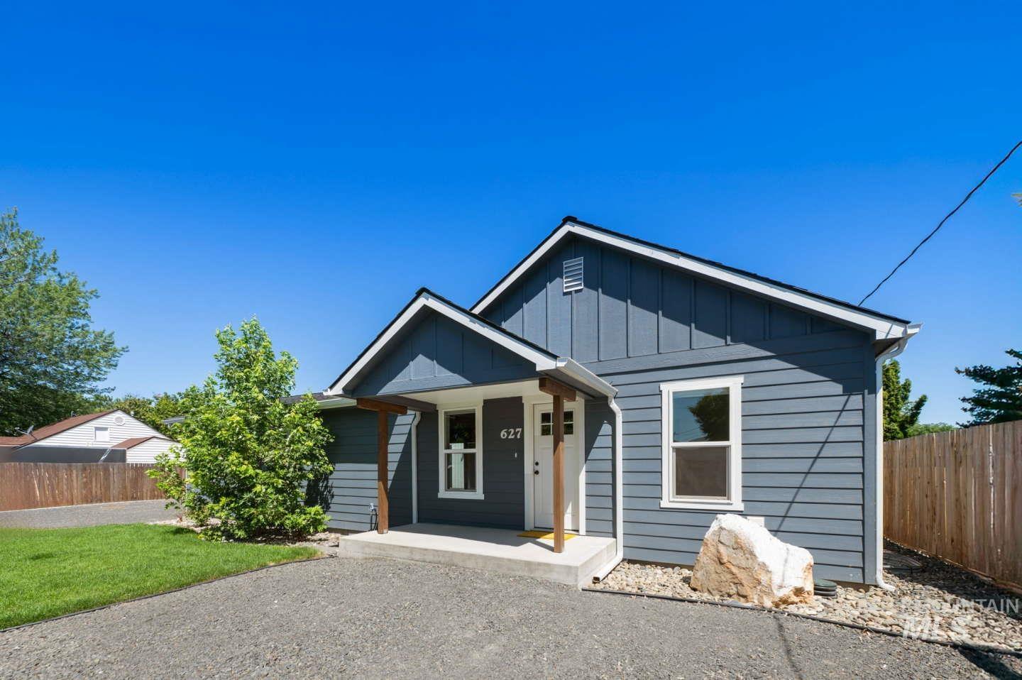 View of front of home featuring a porch and board and batten siding