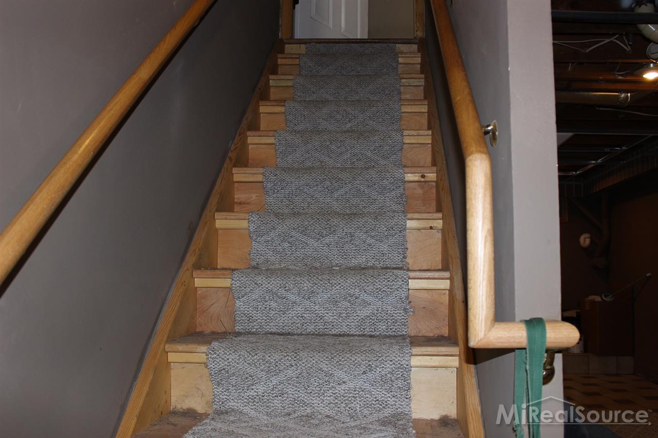 2936 Harvey Street Rochester, MI 48309 - Photo 18 of 29 This oak staircase leads you to the finished basement in style.