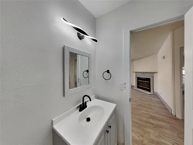 a bathroom with a sink and a mirror