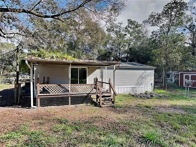 a house view with a backyard space